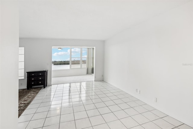 unfurnished room featuring light tile patterned flooring