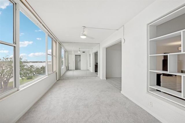 interior space featuring light colored carpet