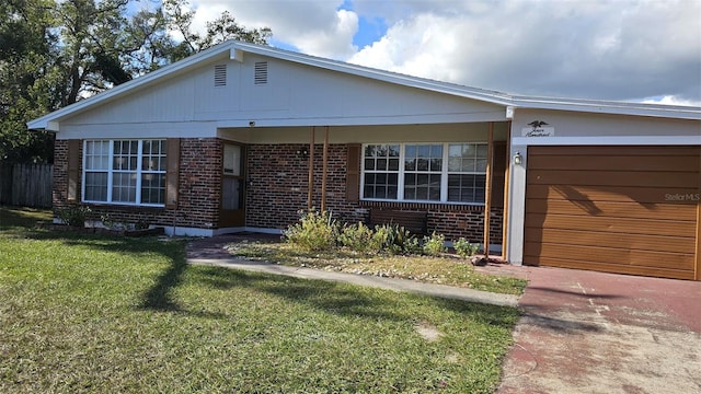 view of front facade with a front yard and a garage