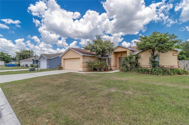 single story home with a front yard and a garage