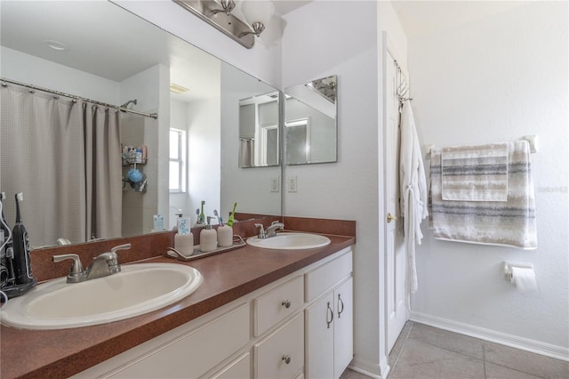 bathroom featuring tile patterned flooring and vanity