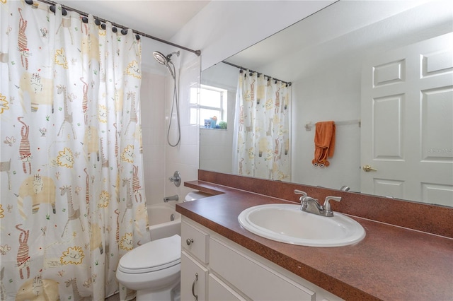 full bathroom featuring shower / bath combo with shower curtain, vanity, and toilet