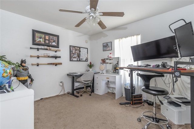 office area featuring light carpet and ceiling fan