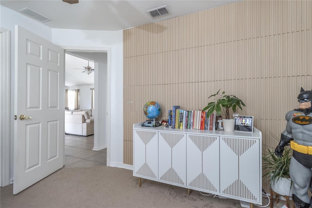 interior space featuring ceiling fan