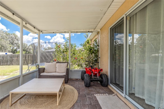 sunroom featuring a wealth of natural light