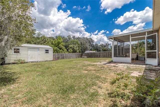 view of yard with a storage unit and a sunroom