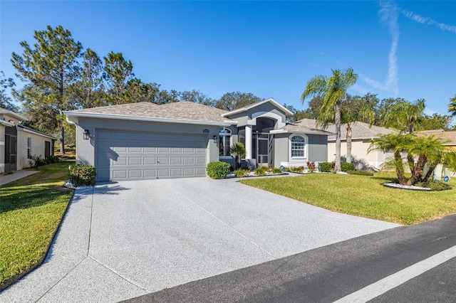 ranch-style home with a garage and a front yard