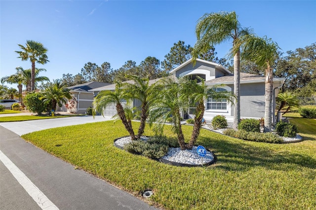 view of front of house featuring a garage and a front yard