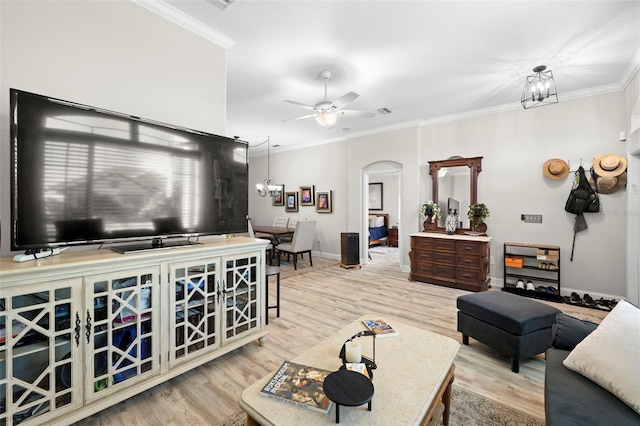 living room with crown molding, light hardwood / wood-style flooring, and ceiling fan with notable chandelier