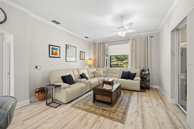 living room featuring ceiling fan, light hardwood / wood-style floors, and ornamental molding