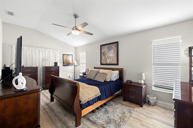 bedroom with light wood-type flooring, ceiling fan, and lofted ceiling