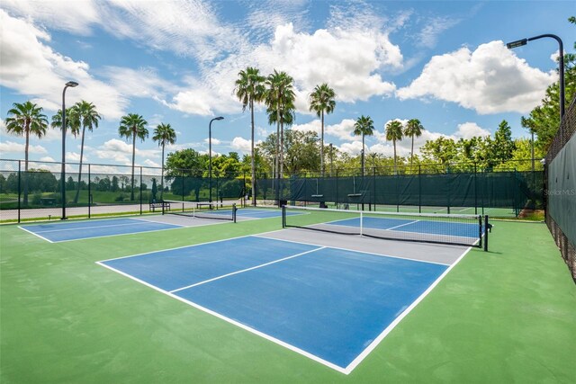 view of sport court with basketball hoop