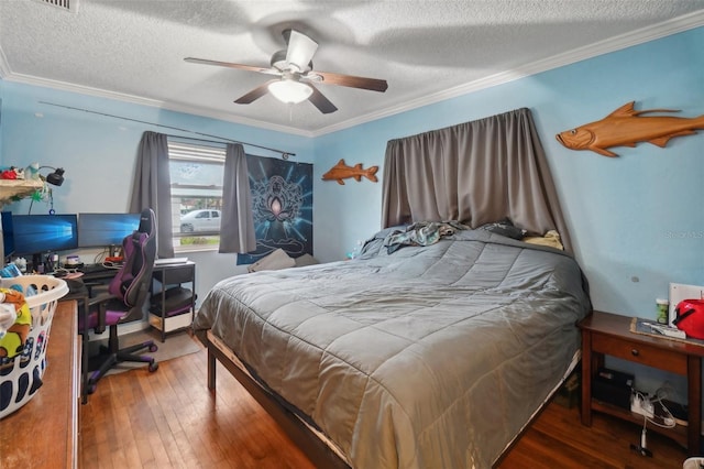 bedroom with a textured ceiling, ceiling fan, crown molding, and dark wood-type flooring