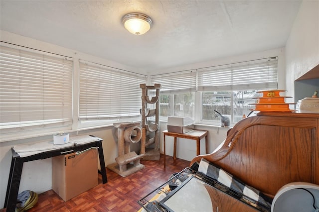 sitting room featuring dark parquet floors