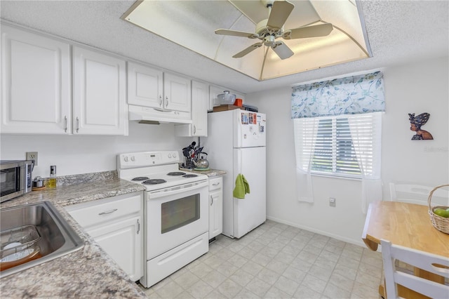 kitchen featuring a textured ceiling, white appliances, ceiling fan, sink, and white cabinetry