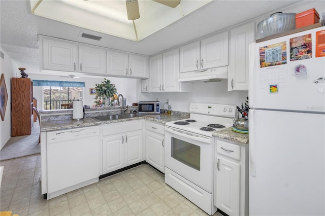 kitchen with ceiling fan, sink, a textured ceiling, white appliances, and white cabinets