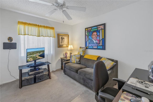 carpeted living room with ceiling fan and a textured ceiling