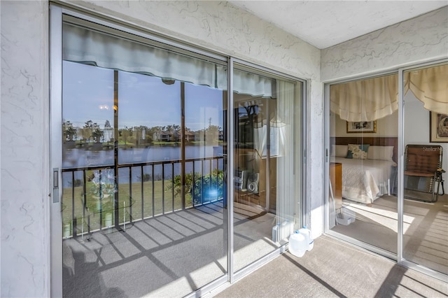 unfurnished sunroom with a water view