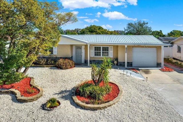 ranch-style house featuring a garage