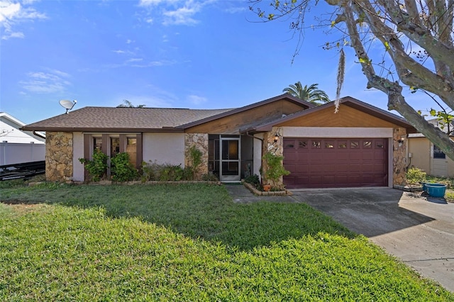 ranch-style home featuring a garage and a front lawn