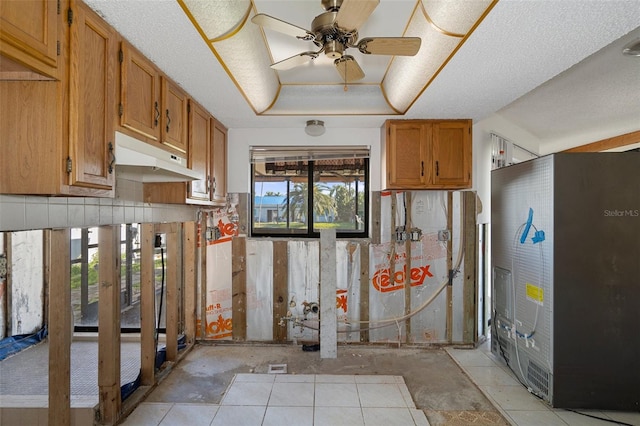 kitchen with a wealth of natural light and ceiling fan