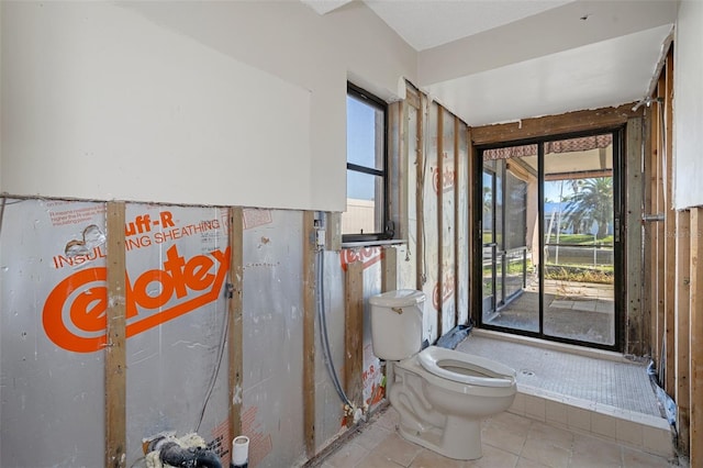 bathroom featuring tile patterned flooring and toilet