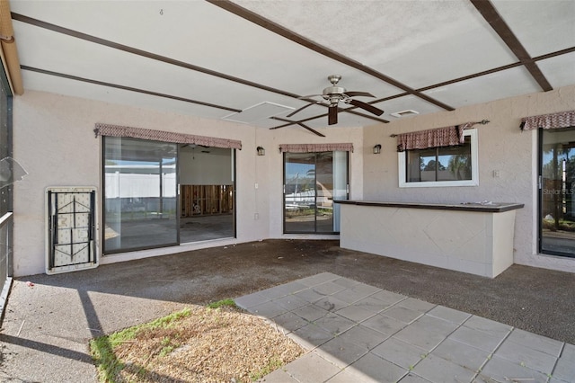 view of patio featuring ceiling fan