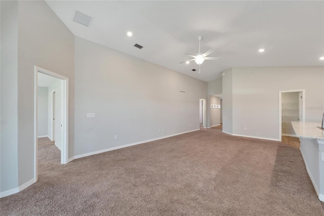 unfurnished living room featuring light colored carpet, high vaulted ceiling, and ceiling fan