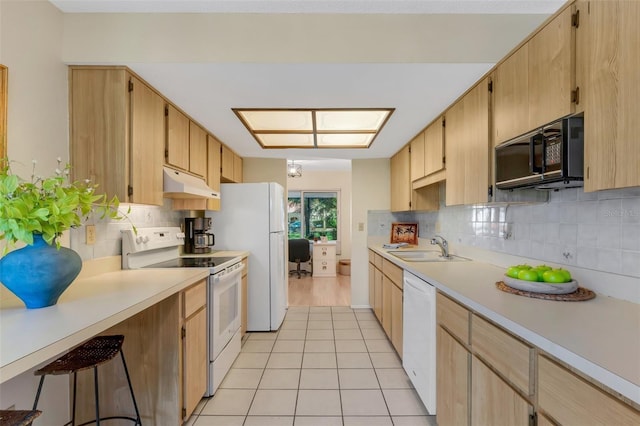 kitchen featuring light tile patterned floors, white appliances, tasteful backsplash, and sink