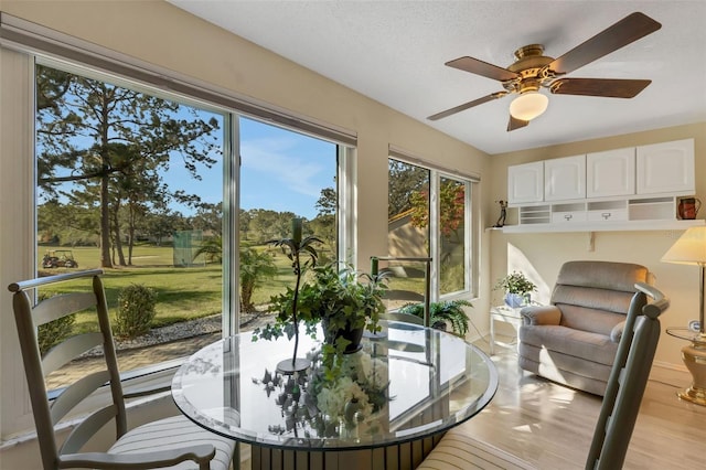 sunroom / solarium with ceiling fan