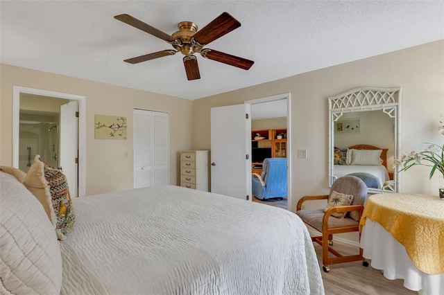 bedroom with light wood-type flooring, a closet, and ceiling fan