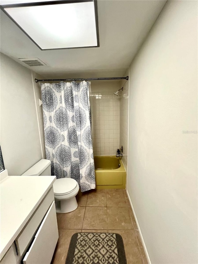 full bathroom featuring toilet, shower / bath combination with curtain, vanity, and tile patterned floors