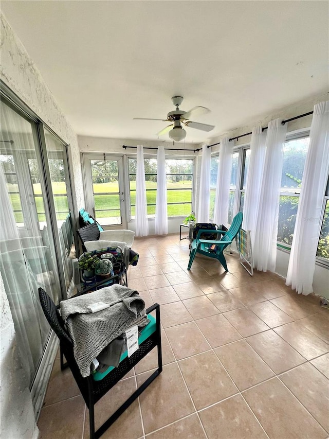 sunroom featuring plenty of natural light and ceiling fan