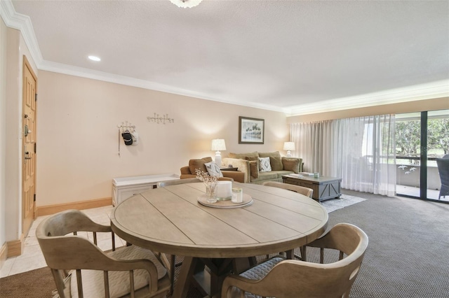 dining area featuring light colored carpet and ornamental molding