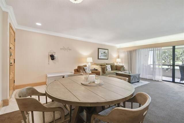36750 US Highway 19 N Unit 19219, Palm Harbor, FL 34684 - carpeted dining area featuring crown molding, recessed lighting, and baseboards