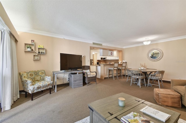 living room with crown molding, carpet floors, and a textured ceiling