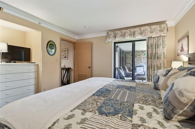 bedroom with access to exterior, a textured ceiling, and ornamental molding