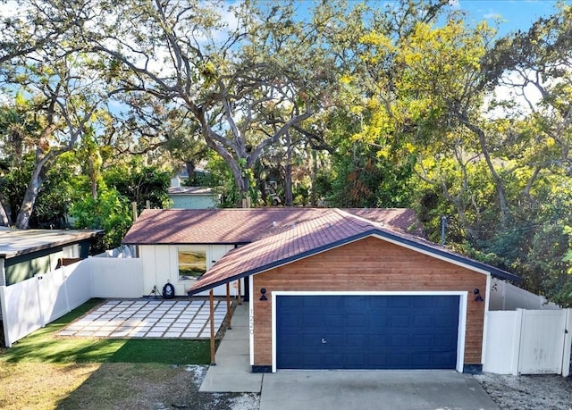 view of front of property with a garage