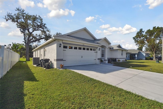 ranch-style home featuring a front yard, an attached garage, driveway, and fence