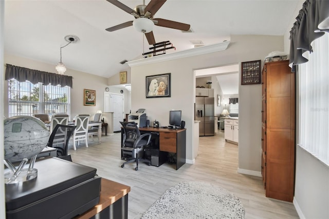 home office featuring visible vents, baseboards, lofted ceiling, light wood-style floors, and a ceiling fan