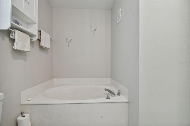 bathroom with a garden tub