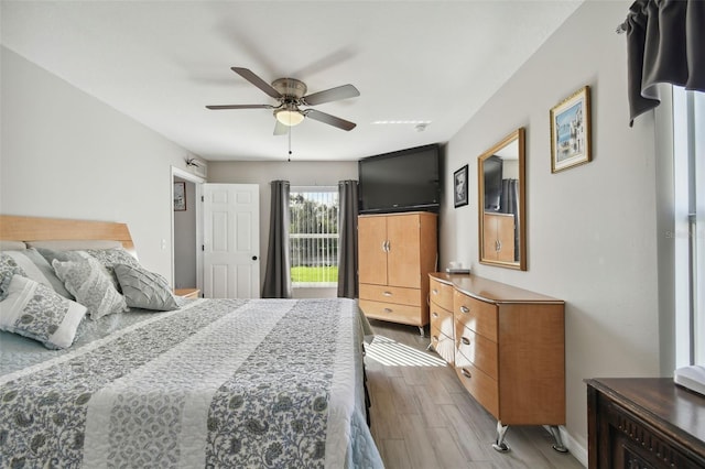 bedroom with wood finished floors and ceiling fan