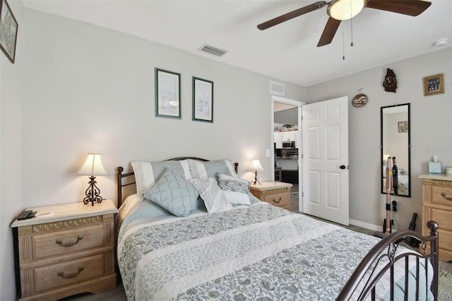 bedroom featuring a ceiling fan, visible vents, and baseboards