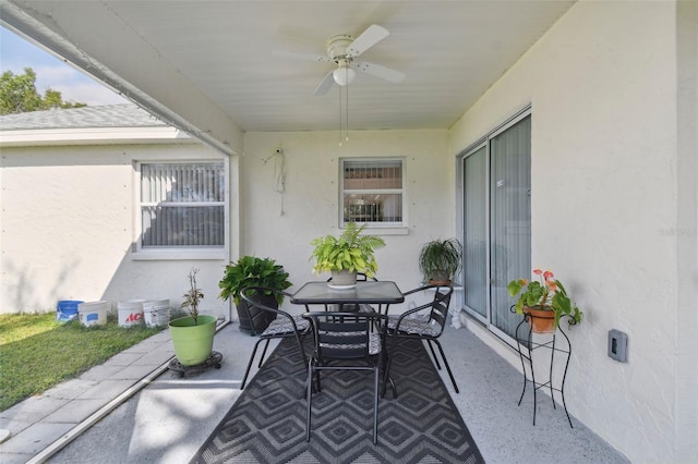 view of patio featuring outdoor dining area and ceiling fan