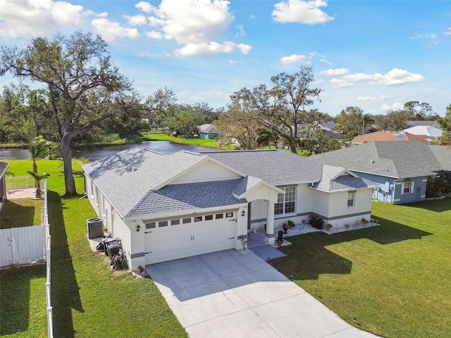 ranch-style home with driveway, fence, roof with shingles, a front yard, and an attached garage