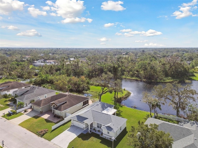 aerial view with a residential view, a forest view, and a water view