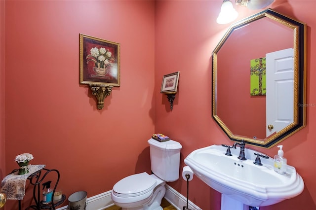 bathroom with toilet and sink