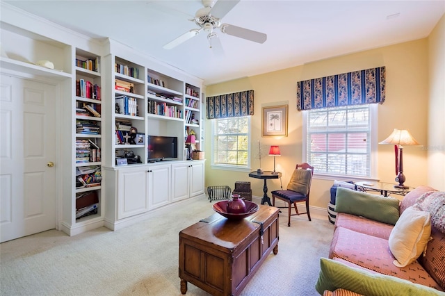 carpeted living room featuring ceiling fan