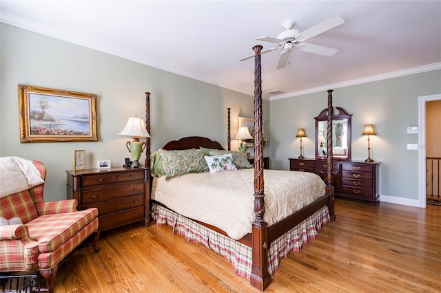 bedroom with light hardwood / wood-style flooring, ceiling fan, and crown molding