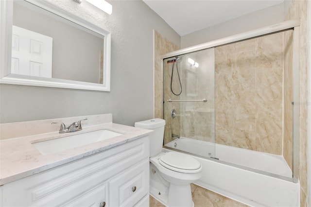 full bathroom featuring tile patterned floors, vanity, toilet, and enclosed tub / shower combo